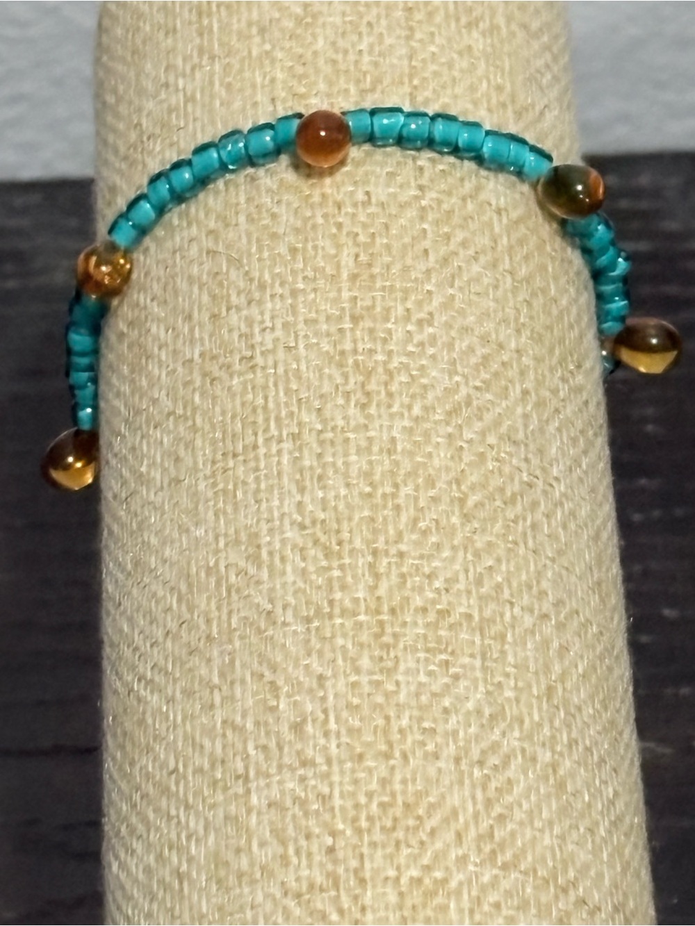Handcrafted teal and orange beaded bracelet